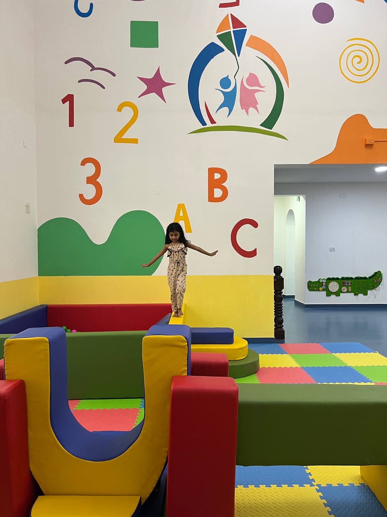 Colorful indoor play area with soft blocks